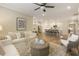 Spacious living room seamlessly connected to the kitchen and dining area at 714 Chipping Sparrow St, Canton, GA 30115
