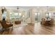 Bright living room boasts hardwood floors, a fireplace, and access to the backyard at 714 Chipping Sparrow St, Canton, GA 30115