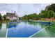 Two pickleball courts ready for play, with lush landscaping, and clubhouse in the background at 714 Chipping Sparrow St, Canton, GA 30115