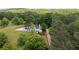 Aerial view of home on wooded lot with long private driveway at 17 Hiram Way, Hiram, GA 30141