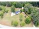 Aerial view of a home with surrounding land and road access at 17 Hiram Way, Hiram, GA 30141
