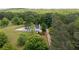 Aerial view of the home nestled among trees and green landscape at 17 Hiram Way, Hiram, GA 30141