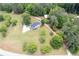 Aerial view of home, garage and wooded lot in a private setting at 17 Hiram Way, Hiram, GA 30141