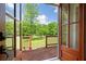 Wooden back deck offers a serene outdoor retreat with views of the lush lawn and surrounding greenery at 17 Hiram Way, Hiram, GA 30141
