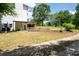 Backyard view showcasing a lush green lawn with trees, a deck, and ample space at 17 Hiram Way, Hiram, GA 30141