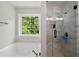Luxurious bathroom with a soaking tub and a glass-enclosed shower at 17 Hiram Way, Hiram, GA 30141