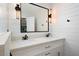 This bathroom includes an elegant vanity and shiplap details at 17 Hiram Way, Hiram, GA 30141