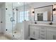 Luxurious bathroom features a glass shower, double vanity, and shiplap wall paneling at 17 Hiram Way, Hiram, GA 30141