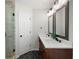 Bathroom featuring double sinks, a stone countertop, and decorative mirrors at 17 Hiram Way, Hiram, GA 30141