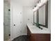 Well-lit bathroom featuring a double sink vanity and a modern glass shower, creating a luxurious feel at 17 Hiram Way, Hiram, GA 30141