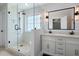 Modern bathroom featuring a glass shower, white cabinets, and sleek fixtures, adding a touch of elegance at 17 Hiram Way, Hiram, GA 30141