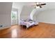 Spacious bedroom featuring hardwood floors, a ceiling fan, and ample natural light, creating a serene retreat at 17 Hiram Way, Hiram, GA 30141
