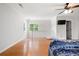 Bright bedroom with hardwood floors, a ceiling fan, and a view from the window, offering a refreshing space at 17 Hiram Way, Hiram, GA 30141