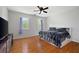 Bedroom with hardwood floors and two windows, offering natural light and a cozy atmosphere at 17 Hiram Way, Hiram, GA 30141
