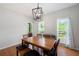Bright dining room features hardwood floors and a modern pendant light fixture at 17 Hiram Way, Hiram, GA 30141