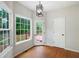 Dining area with hardwood floors, windows, and a glass pane door to the deck at 17 Hiram Way, Hiram, GA 30141