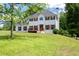 Well-maintained two-story home with green lawn, deck, and chimney at 17 Hiram Way, Hiram, GA 30141