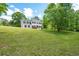Spacious two-story home with shutters sits atop a lush green lawn at 17 Hiram Way, Hiram, GA 30141