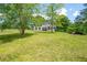 Charming two-story home with shutters, surrounded by a green lawn and trees at 17 Hiram Way, Hiram, GA 30141