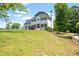 Traditional two-story home with a chimney, shutters and a sprawling front lawn at 17 Hiram Way, Hiram, GA 30141