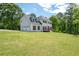 Traditional home with white exterior, dark shutters, and attached two-car garage at 17 Hiram Way, Hiram, GA 30141