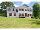 Charming two-story home featuring a white exterior, wood shutters, and a well-maintained front lawn at 17 Hiram Way, Hiram, GA 30141