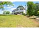 Traditional home with white exterior, dark shutters, and covered front porch at 17 Hiram Way, Hiram, GA 30141