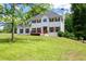Two-story home featuring a white exterior, wood shutters, a chimney and a well-maintained front lawn at 17 Hiram Way, Hiram, GA 30141