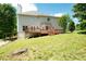 Exterior view showcasing a two-story house with a deck and a grassy backyard at 17 Hiram Way, Hiram, GA 30141