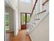 Beautiful foyer with hardwood floors and staircase with white railing at 17 Hiram Way, Hiram, GA 30141