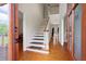 Inviting foyer features wood floors and staircase, offering a warm welcome to the home's interior at 17 Hiram Way, Hiram, GA 30141