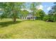Traditional home with a large front yard and shade trees at 17 Hiram Way, Hiram, GA 30141