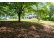 Traditional home with white exterior and dark shutters, set back from the street at 17 Hiram Way, Hiram, GA 30141