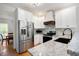 Eat-in kitchen features white cabinets, stainless steel appliances and granite countertops at 17 Hiram Way, Hiram, GA 30141