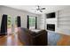 Bright living room features fireplace, built-in shelves, and access to outdoor deck at 17 Hiram Way, Hiram, GA 30141
