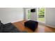 Bright and airy living room with hardwood floors, large windows, and neutral color scheme at 17 Hiram Way, Hiram, GA 30141