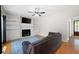 Spacious living room with fireplace, built-in bookshelves, and a ceiling fan at 17 Hiram Way, Hiram, GA 30141