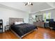 Spacious main bedroom with vaulted ceiling and hardwood floors at 17 Hiram Way, Hiram, GA 30141