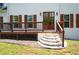 A close up of the home's porch featuring curved steps and wood trim at 17 Hiram Way, Hiram, GA 30141