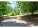 Picture showing the wooded property with mature trees at 17 Hiram Way, Hiram, GA 30141