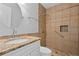 Modern bathroom featuring tiled walk-in shower and vanity with granite counter at 194 Beaverwood Ct, Lawrenceville, GA 30044