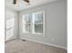 Bedroom featuring neutral paint and two windows at 194 Beaverwood Ct, Lawrenceville, GA 30044