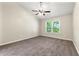 Vaulted bedroom with neutral walls, carpet floors, and a bright window offering natural light at 194 Beaverwood Ct, Lawrenceville, GA 30044