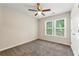 Bedroom with neutral walls, carpet floors, and a bright window offering natural light at 194 Beaverwood Ct, Lawrenceville, GA 30044