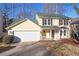 Charming two-story home with a two-car garage and beautifully landscaped front yard at 194 Beaverwood Ct, Lawrenceville, GA 30044