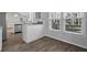 Bright breakfast nook with large windows and a view to the stainless steel kitchen appliances at 194 Beaverwood Ct, Lawrenceville, GA 30044