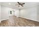 Bright, open living room with hardwood floors, white trim and crown molding, and a ceiling fan at 194 Beaverwood Ct, Lawrenceville, GA 30044