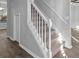 Bright staircase with white railings and carpeted steps in a modern home at 194 Beaverwood Ct, Lawrenceville, GA 30044