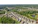 Aerial view of a residential community surrounded by lush greenery and ponds at 2470 Crimson Downs Dr, Cumming, GA 30040