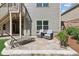 Relaxing backyard patio with comfortable seating, a sun lounger, and a beautifully landscaped area at 2470 Crimson Downs Dr, Cumming, GA 30040